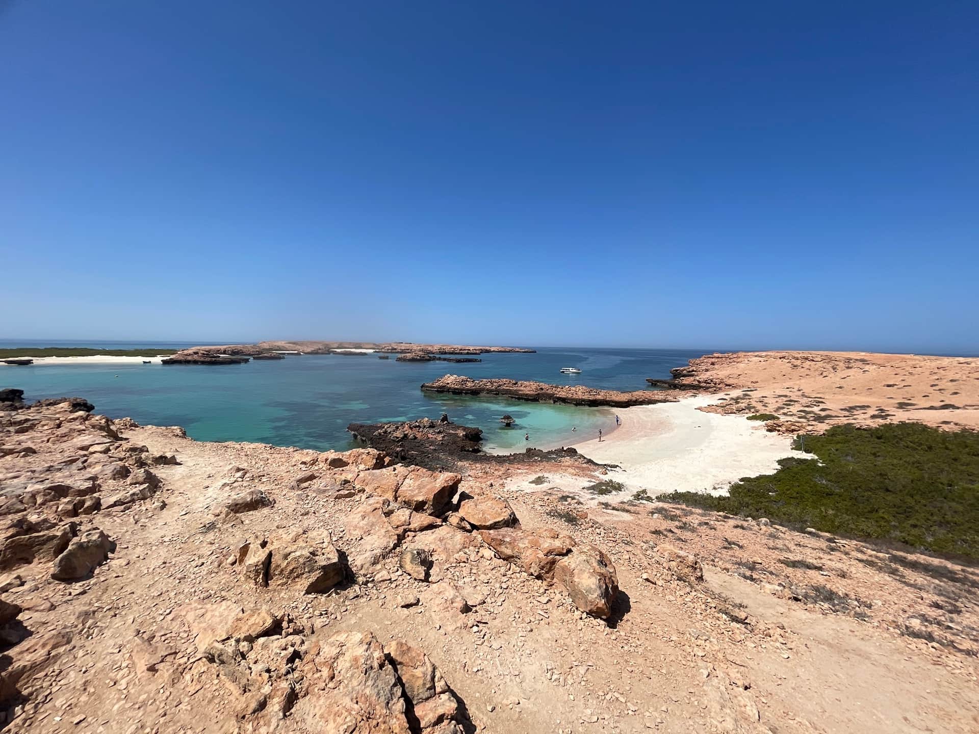Turquoise water, coral reefs and a sandy island at the Daymaniyat Islands near Muscat, Oman